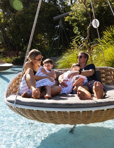 Family in the Swing Chair at the Lagoon Pool at Elements of Byron