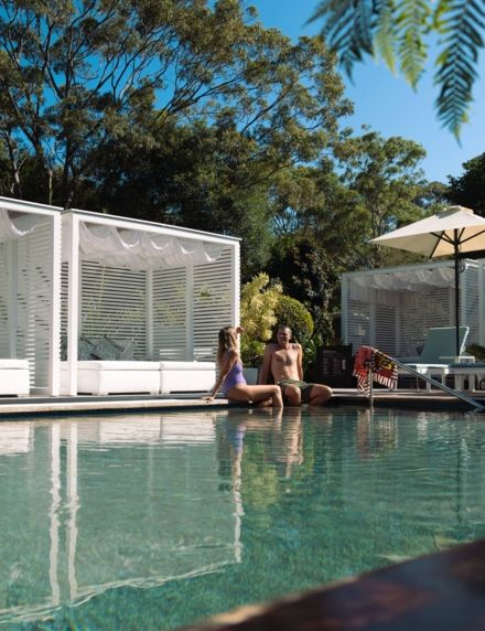 Elements of Byron Adults Pool Couple Lifestyle