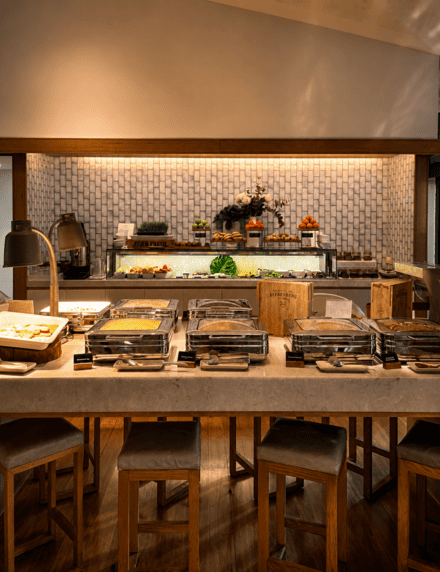 Buffet breakfast in the Pavilion at Elements of Byron, featuring hot breakfast dishes and fresh fruit.