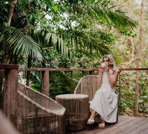 Relaxing with a coffee outside a villa at Elements of Byron