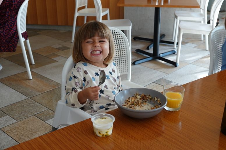 Little girl enjoying breakfast at Azure Bar and Grill