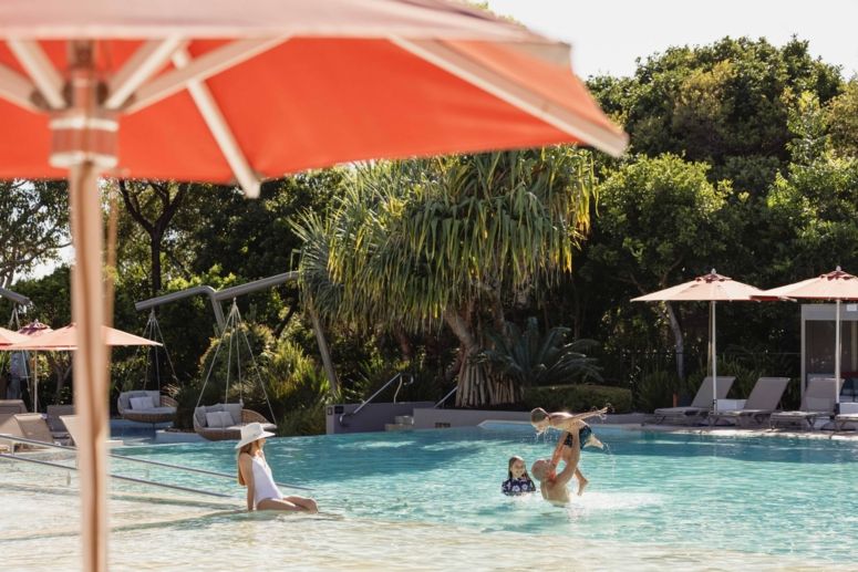 A family playing in the Lagoon Pool at Elements of Byron